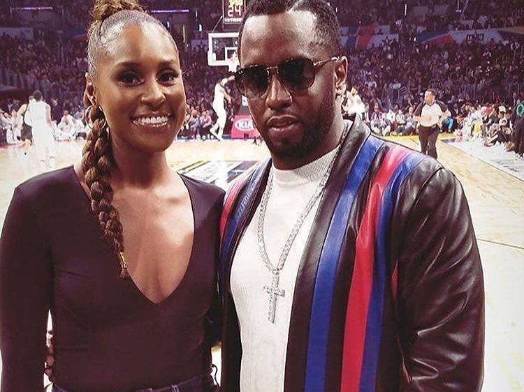 Alicia Keys e Sean Combs, quando ele ainda era o Puff Daddy, em uma partida da NBA